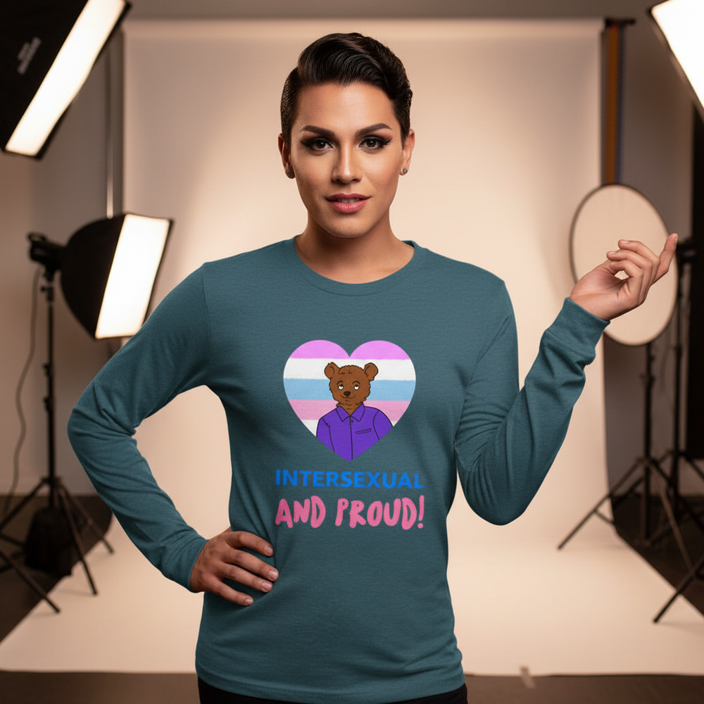 Model wearing a teal long-sleeve shirt reading “INTERSEXUAL AND PROUD!” with a bear in a pride-flag heart