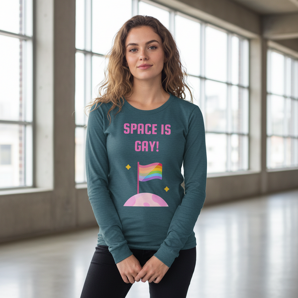 Space Is Gay Unisex Long Sleeve T-Shirt features bold pink slogan and rainbow flag on teal shirt, embodying queer pride and self-expression in a stylish, versatile design.