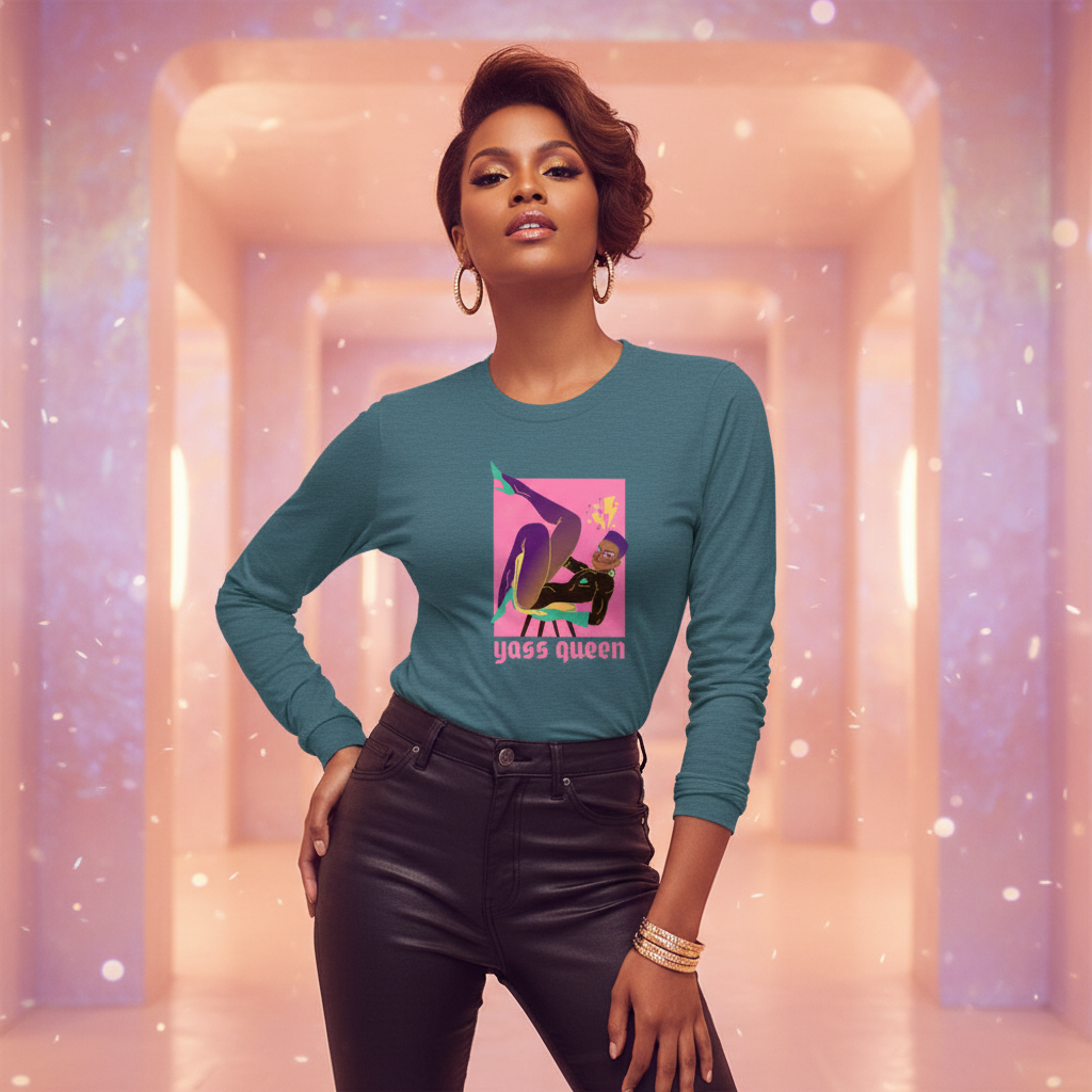Yass Queen Unisex Long Sleeve T-Shirt featuring a pop-art queen illustration, worn with black leather-look pants and gold accessories, embodying confident queer pride and versatile style for every occasion.