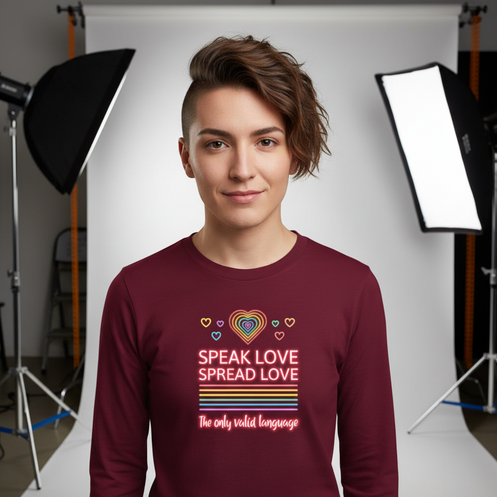 Model wearing a burgundy long-sleeve shirt with neon hearts and “Speak Love Spread Love” text