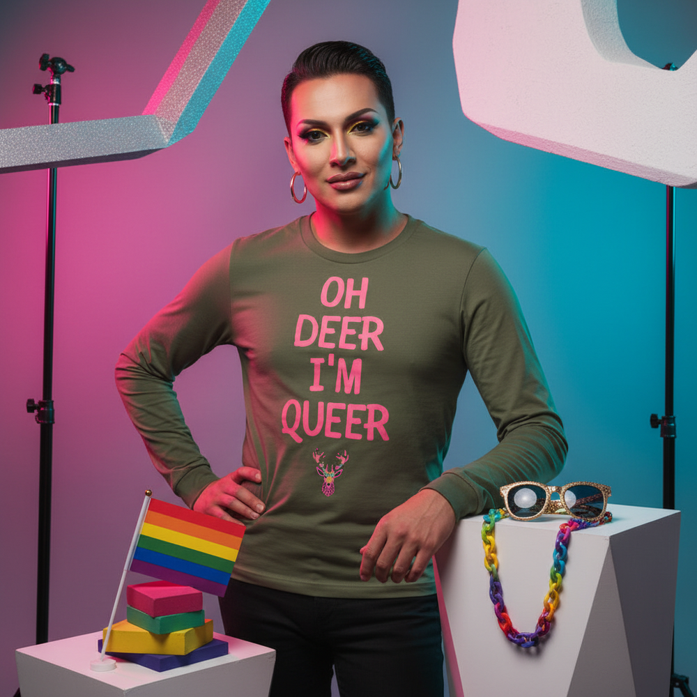 Oh Deer I’m Queer unisex long sleeve tee in olive-green, pink “OH DEER I’M QUEER” slogan, LGBTQ+ symbols and rainbow flags.