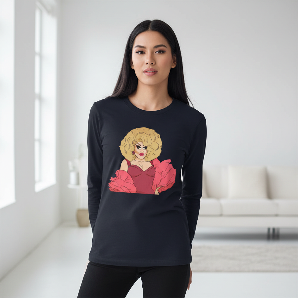 Young woman in a bright room wearing the Sassy Trixie Mattel Unisex Long Sleeve T-Shirt, featuring a vibrant drag queen graphic, embodying colorful queer pride and self-expression.