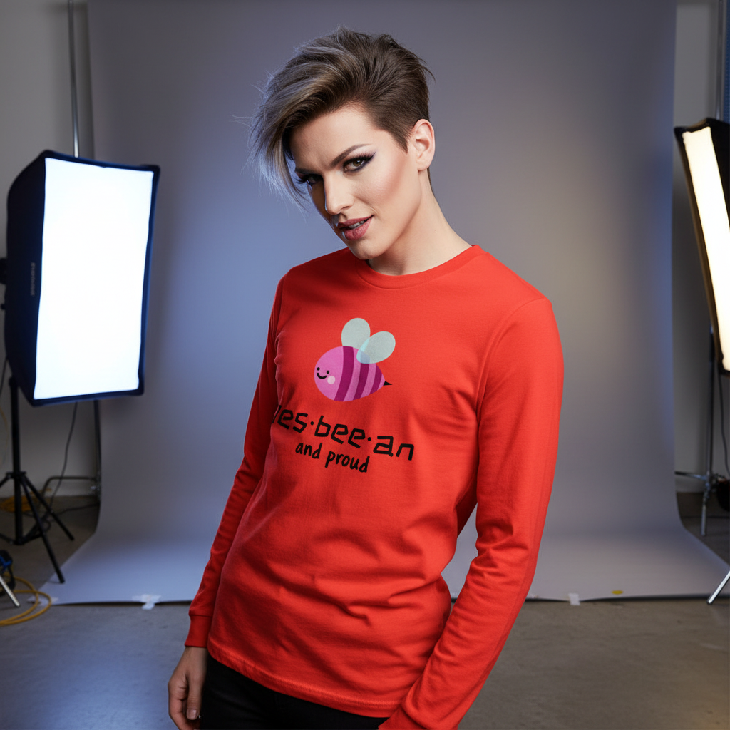 Les-bee-an And Proud Unisex Long Sleeve T-Shirt features a cute cartoon bee with a playful pun, celebrating LGBTQIA+ pride and self-expression in vibrant style.