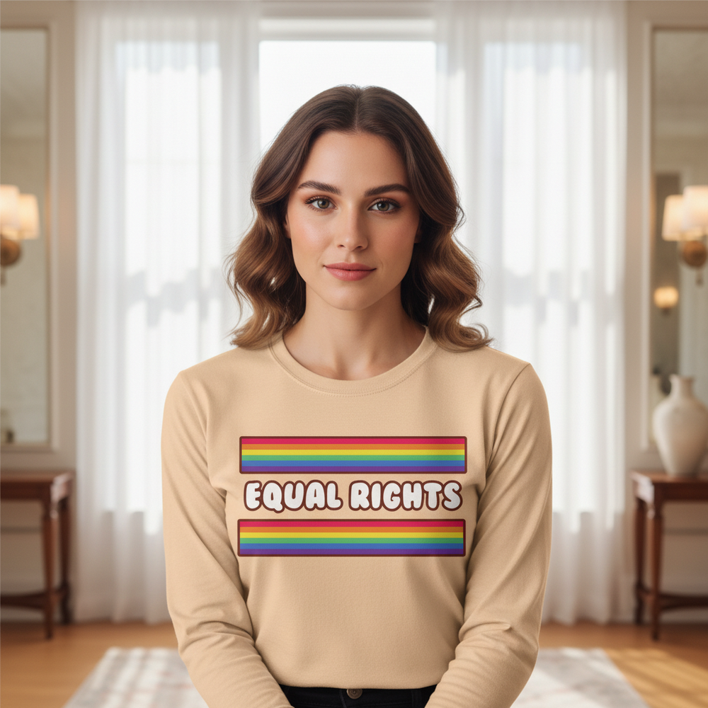 Equal Rights Unisex Long Sleeve T-Shirt with rainbow stripes and "EQUAL RIGHTS" on the front, worn by a woman indoors.