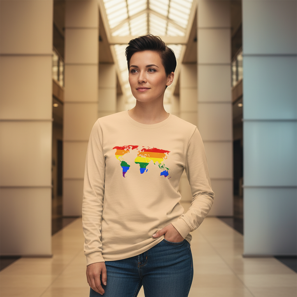 Gay Map Unisex Long Sleeve T-Shirt in beige with a rainbow world map, worn by a short-haired person embodying queer pride.