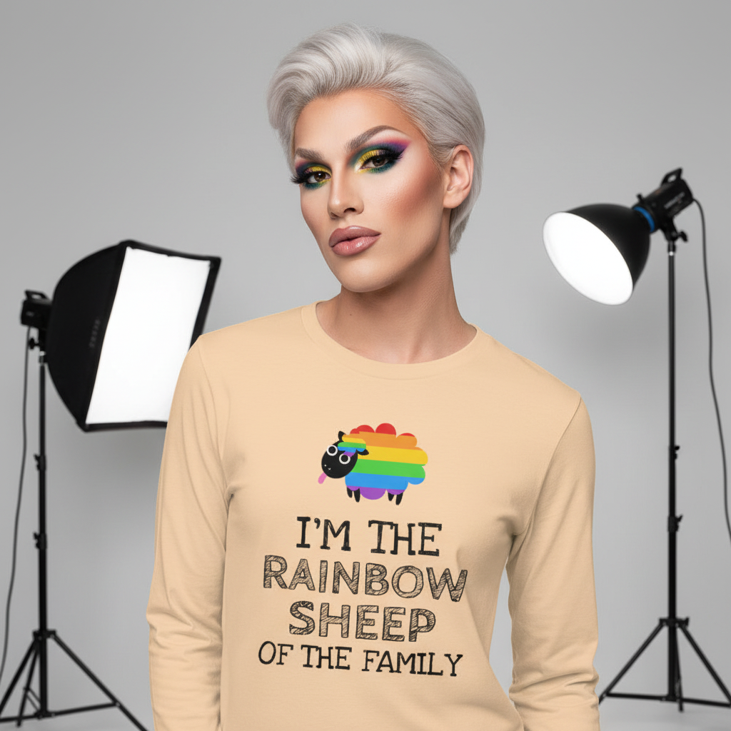 A person models the I'm The Rainbow Sheep Of The Family unisex long sleeve t-shirt with colorful eye makeup, showcasing queer empowerment and self-expression in a vibrant photography studio setting.