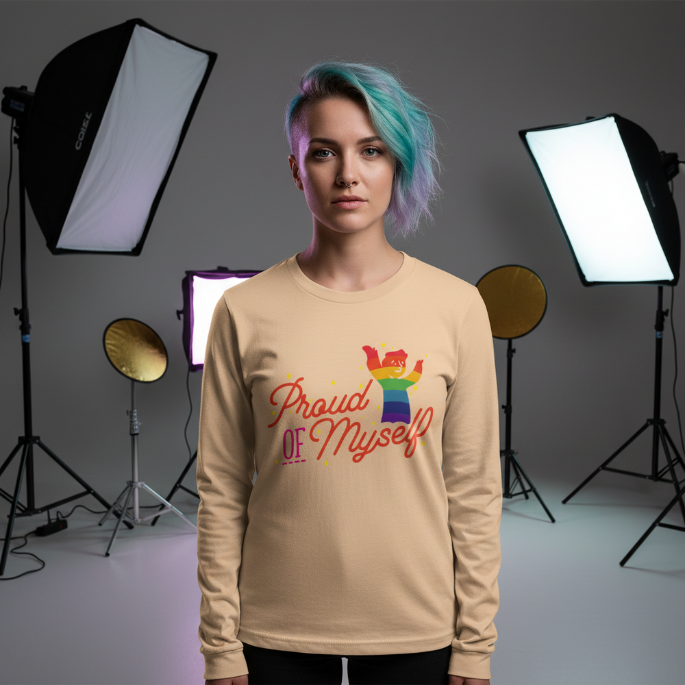 Model wearing a tan long-sleeve shirt reading “Proud OF Myself” with a rainbow graphic