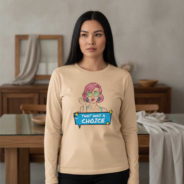 Model wearing a beige long-sleeve shirt with a pop-art person and “THAT WAS A CHOICE” graphic