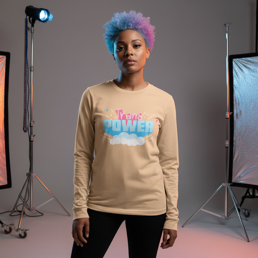 Model wearing a beige long-sleeve shirt with colorful “Trans POWER” lettering in a studio