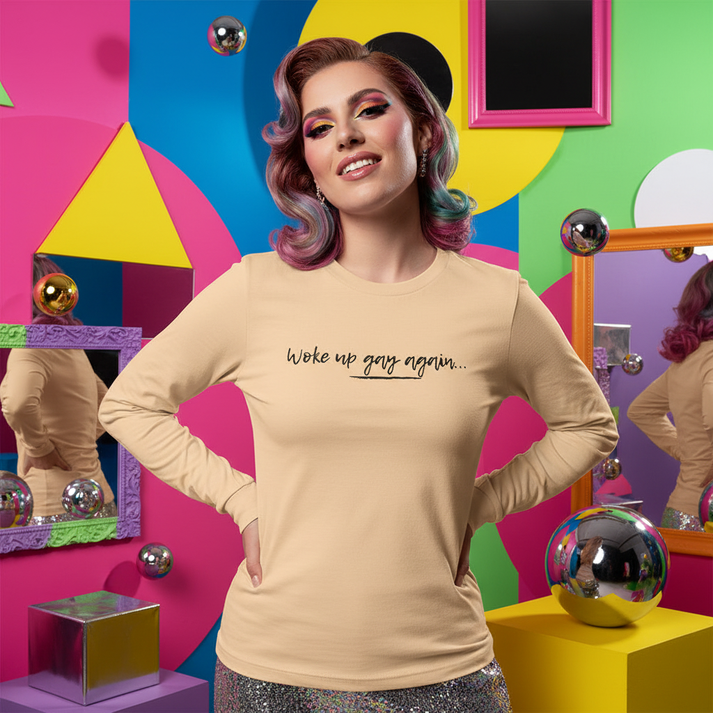 Model wearing a beige long-sleeve shirt reading “Woke up gay again...”