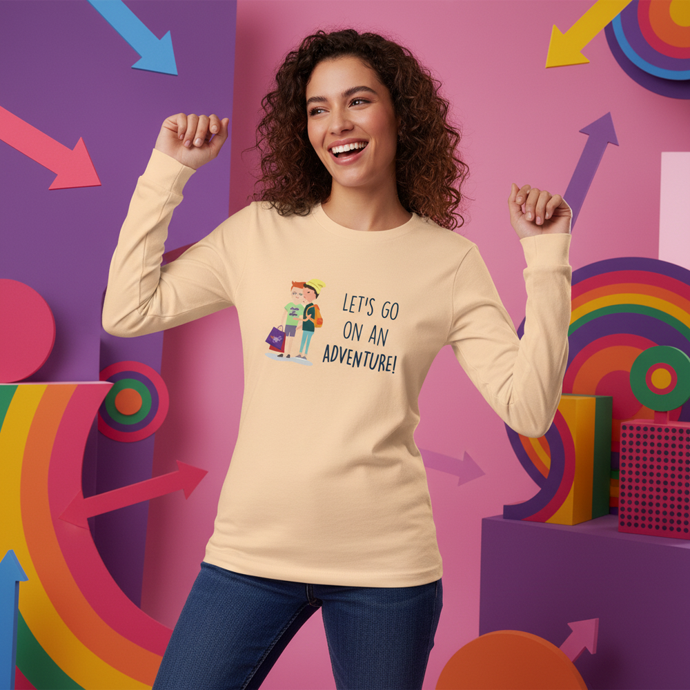 Smiling model wears a beige long-sleeve shirt reading “LET’S GO ON AN ADVENTURE!”