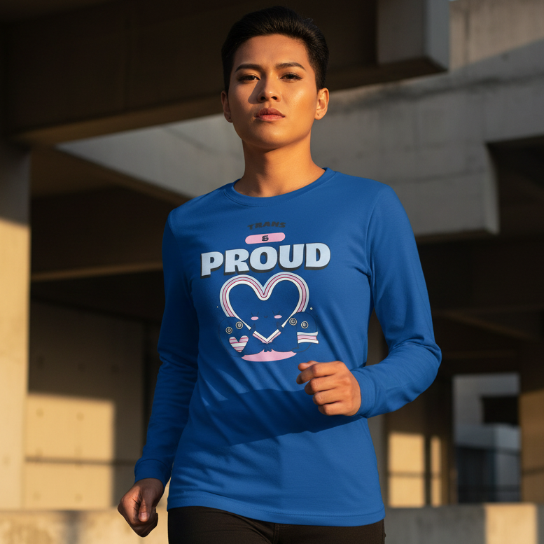 Person jogging in a concrete setting, wearing the Trans & Proud Unisex Long Sleeve T-Shirt, featuring TRANS is PROUD and trans-flag heart embraced by cartoon figures, celebrating pride and visibility.