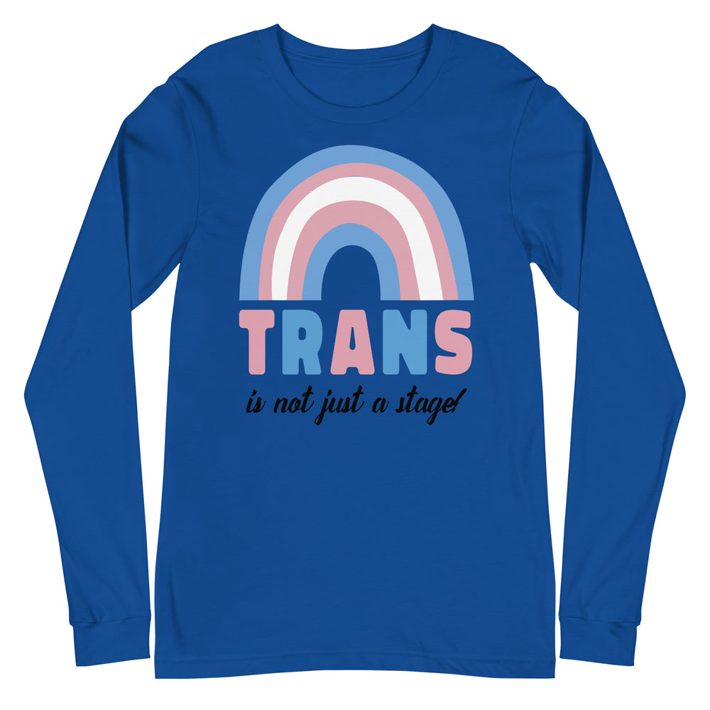 Front view of a blue long-sleeve shirt with a pink, white, and blue rainbow and “TRANS is not just a stage!” text
