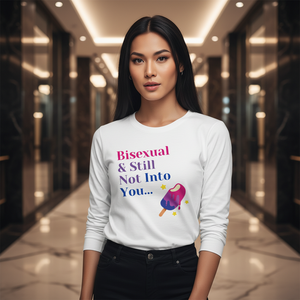 Unisex long sleeve tee says "Bisexual & Still Not Into You," with a colorful popsicle; queer femme stands hands in pockets.
