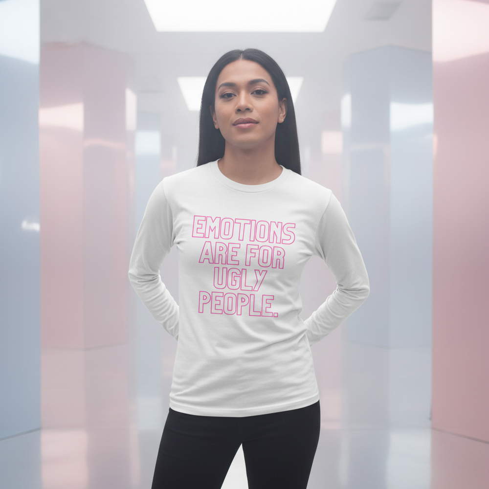 Unisex long sleeve tee in soft pastels reads “Emotions Are For Ugly People” in bold pink; femme model poses, facing camera.