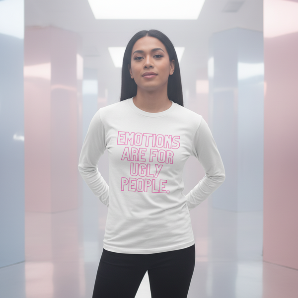 Unisex long sleeve tee in soft pastels reads “Emotions Are For Ugly People” in bold pink; femme model poses, facing camera.