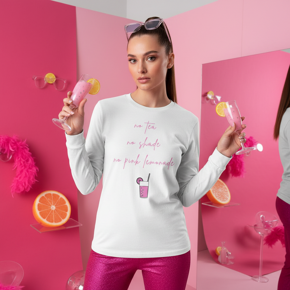 Model wearing a white long-sleeve shirt reading “no tea no shade no pink lemonade”