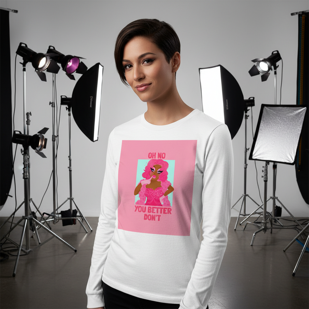 Model wearing a white long-sleeve shirt with a pink drag performer graphic and “OH NO YOU BETTER DON'T” text
