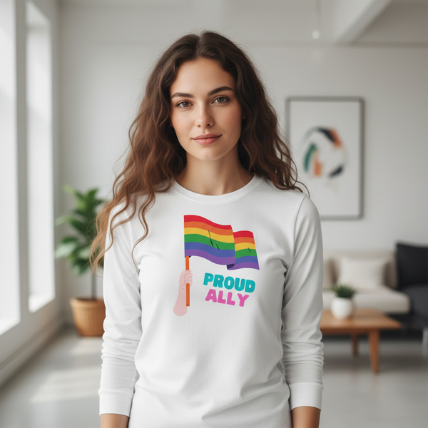 Front view of a model wearing a white long-sleeve shirt with rainbow flags and “PROUD ALLY” text