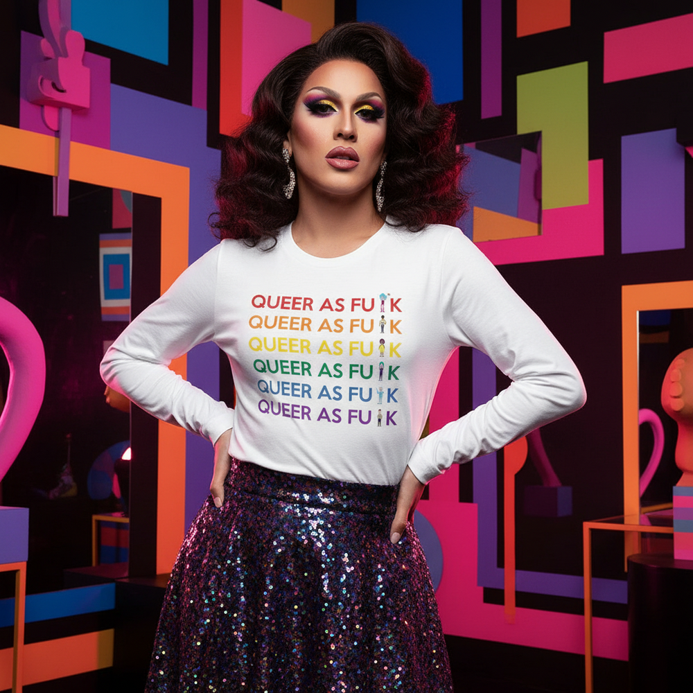 Model wears a white long-sleeve shirt reading “QUEER AS FU*K” in rainbow rows