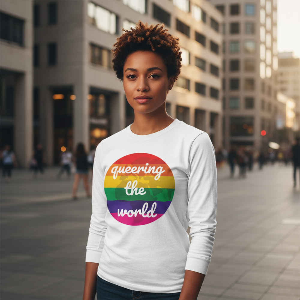 Model wearing a white long-sleeve shirt with a rainbow circle reading “Queering the world”