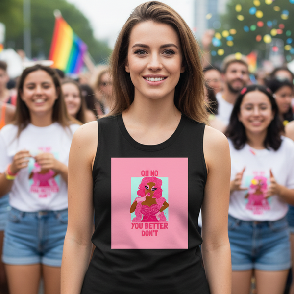 Oh No You Betta Don’t Muscle Top with bold text and pink drag queen art; woman at pride leads marchers waving rainbow flags.