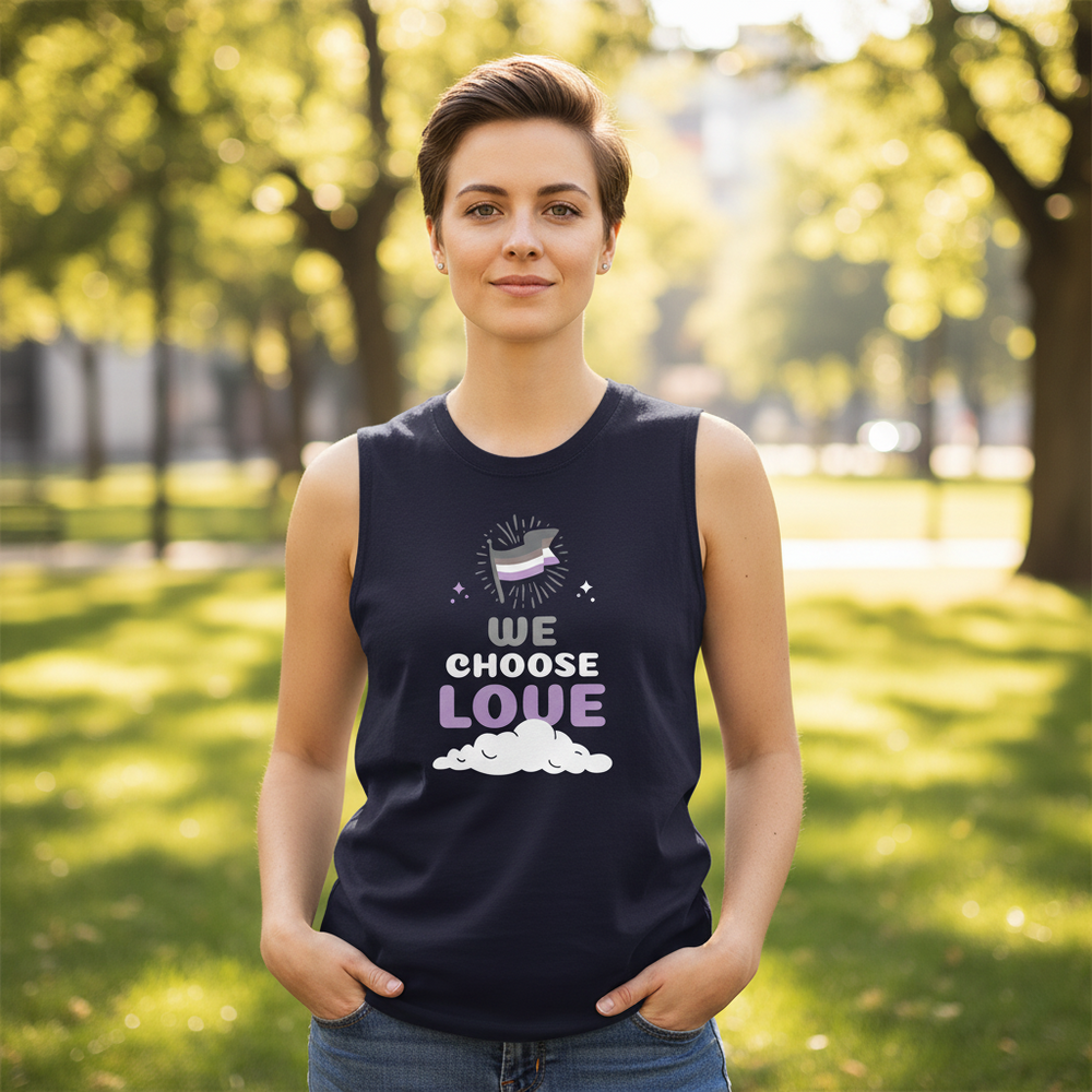 Asexual We Choose Love Muscle Top with rainbow and cloud graphic, worn by a short-haired person in a sunlit, peaceful park.