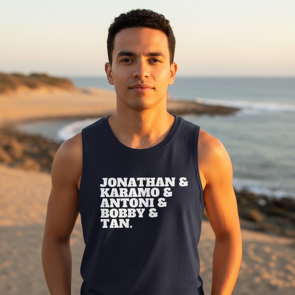 Muscle tank reads “Jonathan & Karamo & Antoni & Bobby & Tan”; young queer man sunset beach, ocean and clear sky backdrop.