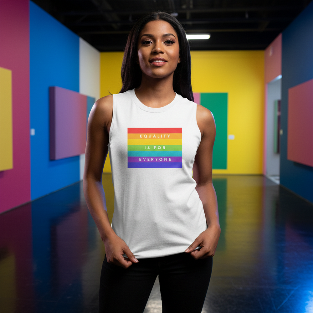 White "Equality Is For Everyone" muscle tank with a rainbow flag, worn by a woman in front of bold queer gallery art.
