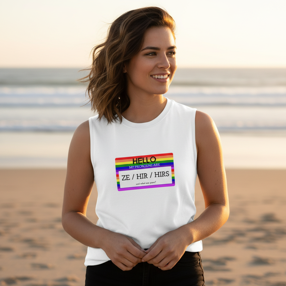 Muscle top reading "Hello My Pronouns Are Ze / Hir / Hirs" worn by a smiling person on a sunlit, vibrant queer beach scene.