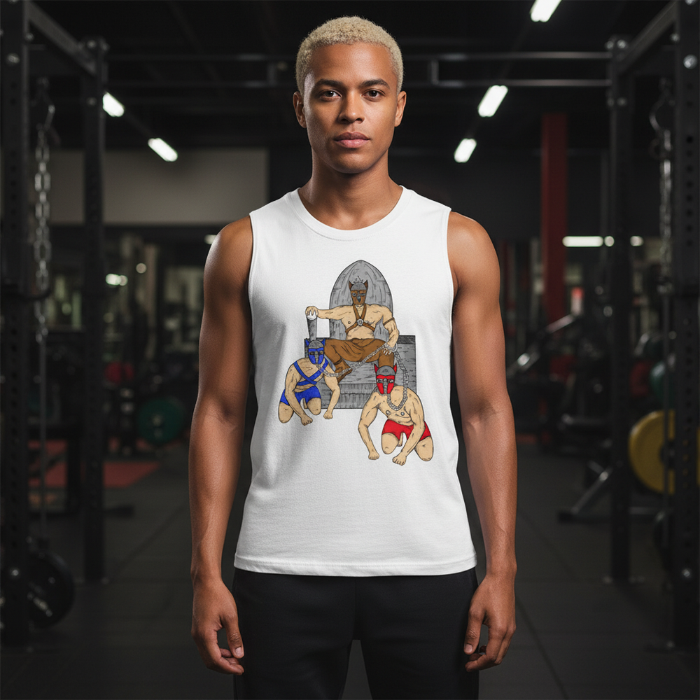 Pup Play Muscle Top with a throne and two masked wrestlers graphic, worn by a blond man in a gym with weights behind him.