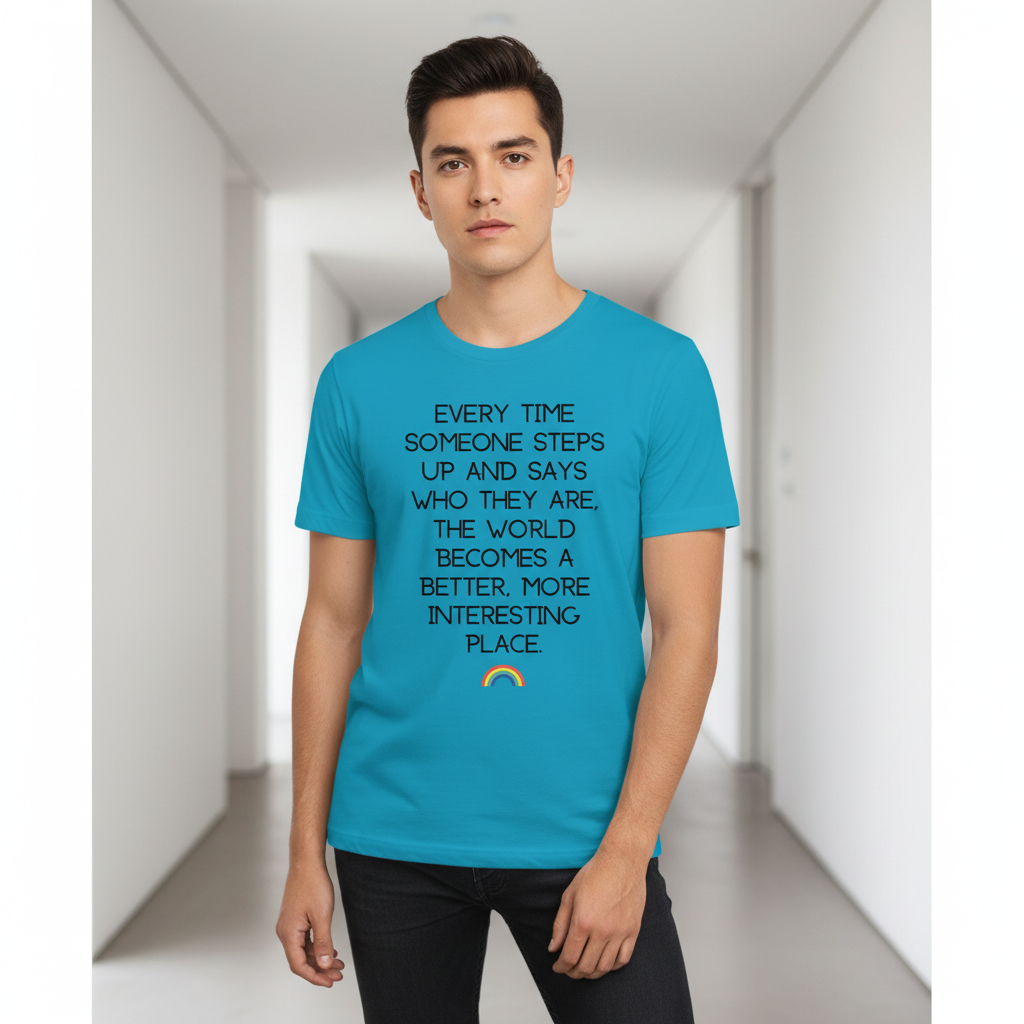 Front-view model wearing a turquoise T-shirt with a rainbow and printed inspirational message