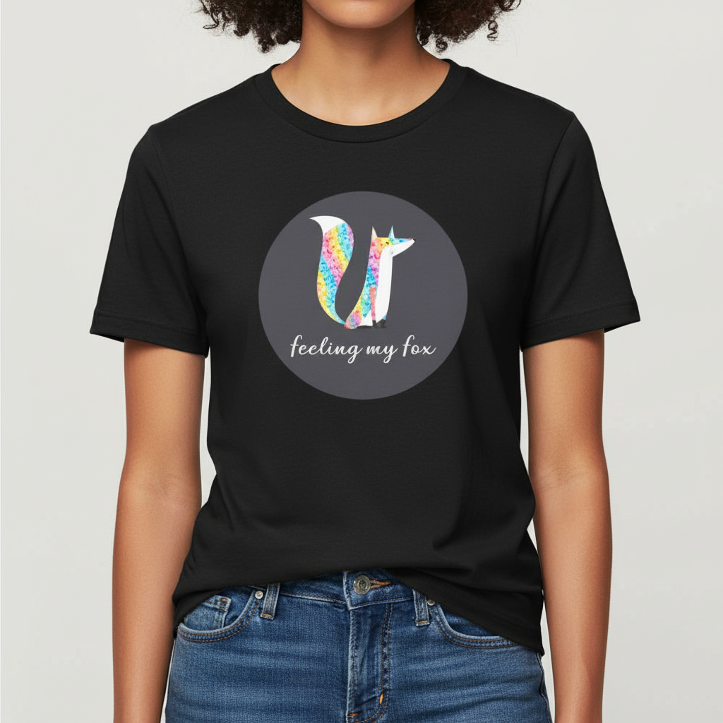 Unisex Feeling My Fox T-Shirt in soft cotton, with bold geometric fox art and "feeling my fox" text; hands in jeans pockets.