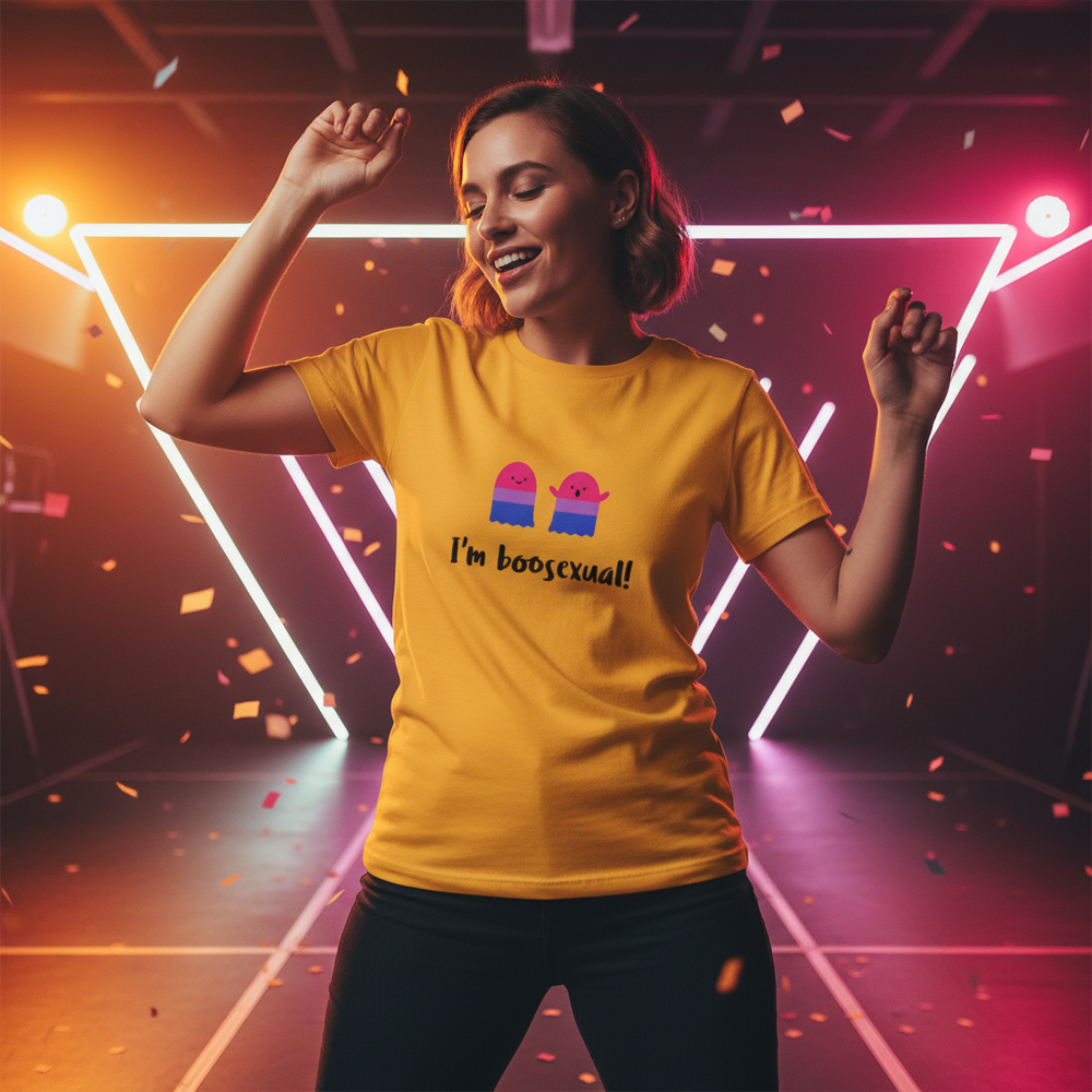 Bright yellow cotton "I'm Boosexual" t-shirt with two cartoon ghosts, worn by a person dancing in confetti under neon lights.