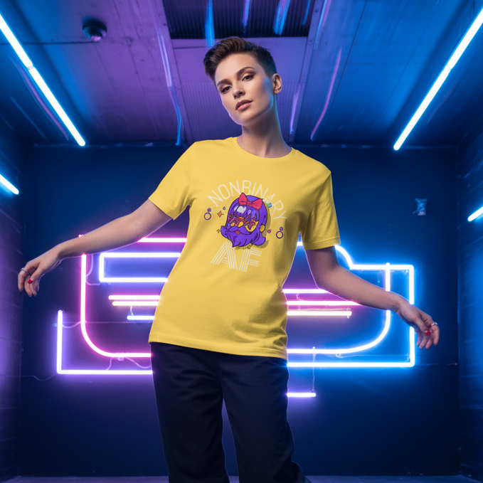 Nonbinary AF T-Shirt on a short-haired person, set against blue and pink neon geometric lights, serving queer pride energy.