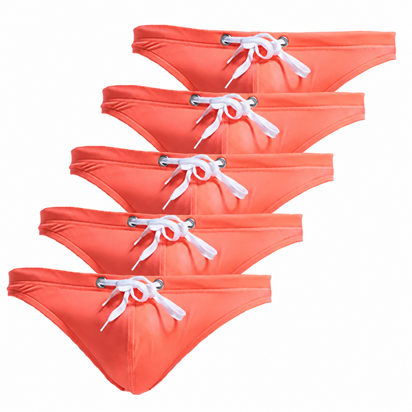 Five coral-orange swim briefs arranged in a descending diagonal on white