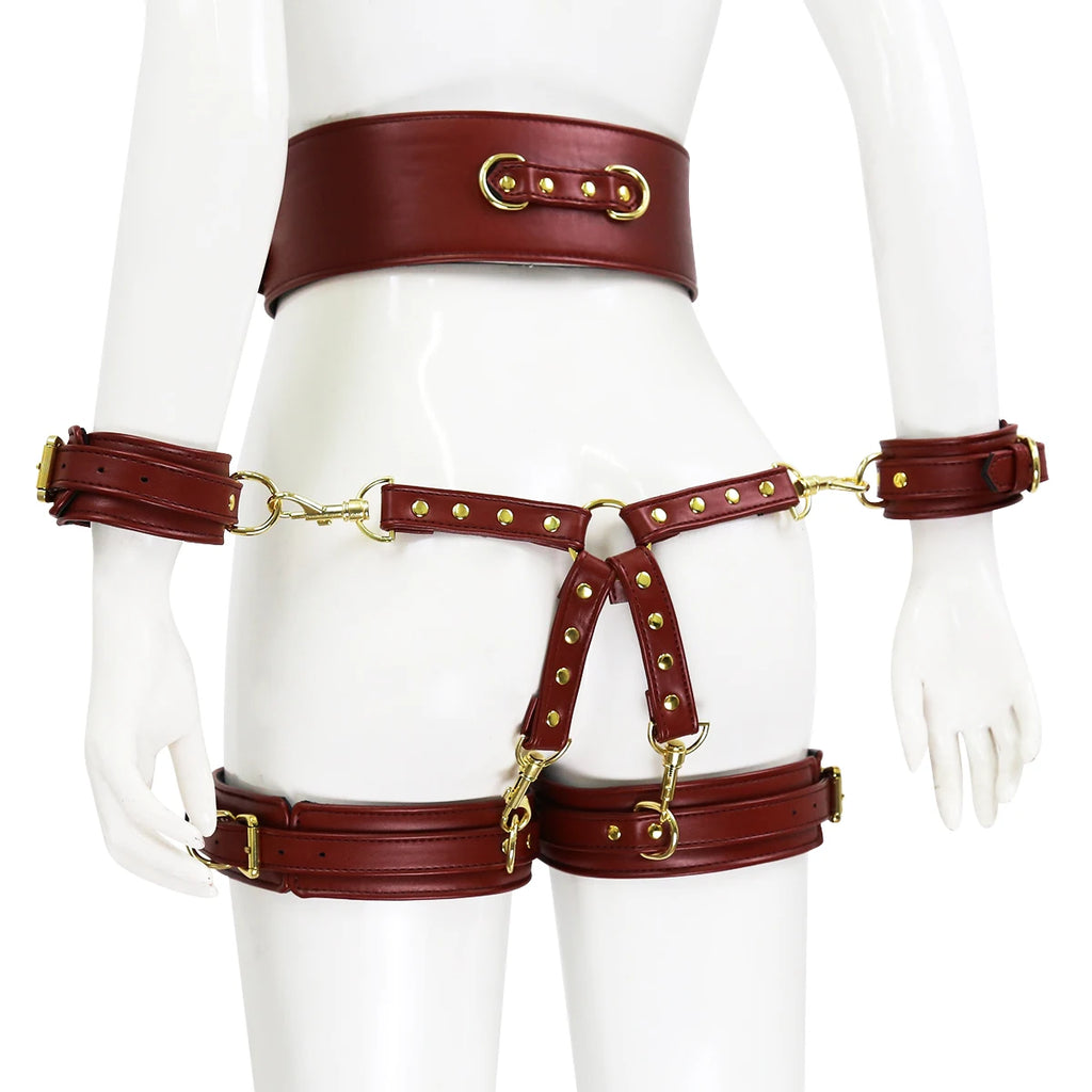 Front view of a burgundy leather body harness with wrist and thigh cuffs