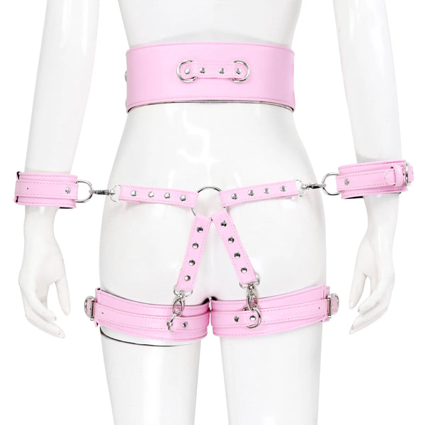 Front view of a pink leather body harness with wrist and thigh cuffs on a mannequin