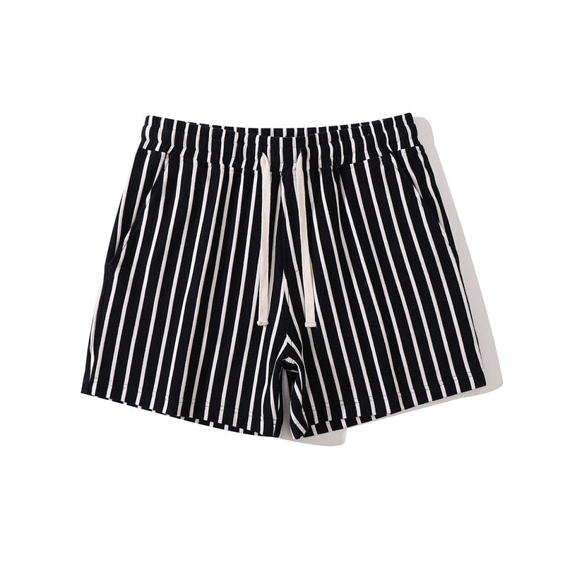 Front view of black shorts with narrow white vertical stripes and a white drawstring