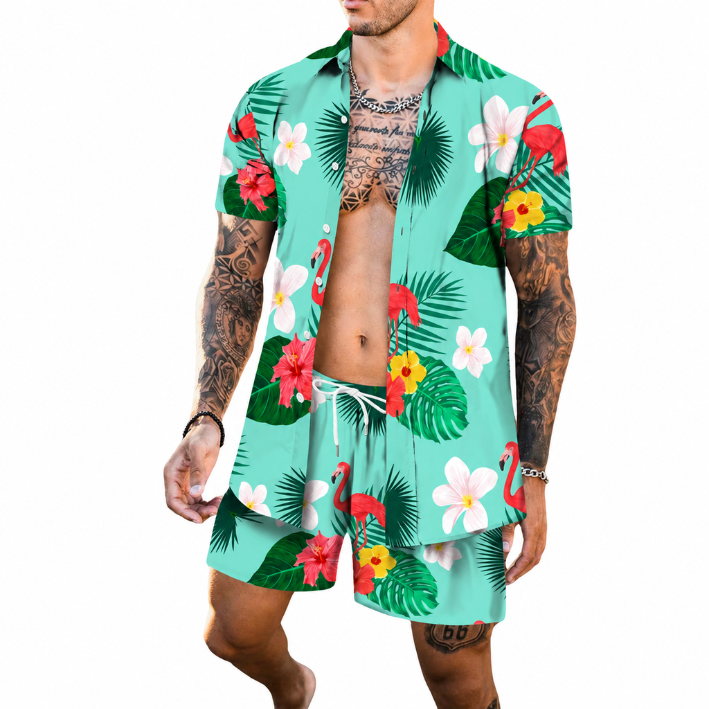Model wearing a turquoise tropical shirt and shorts set with flamingos, flowers, and palm leaves