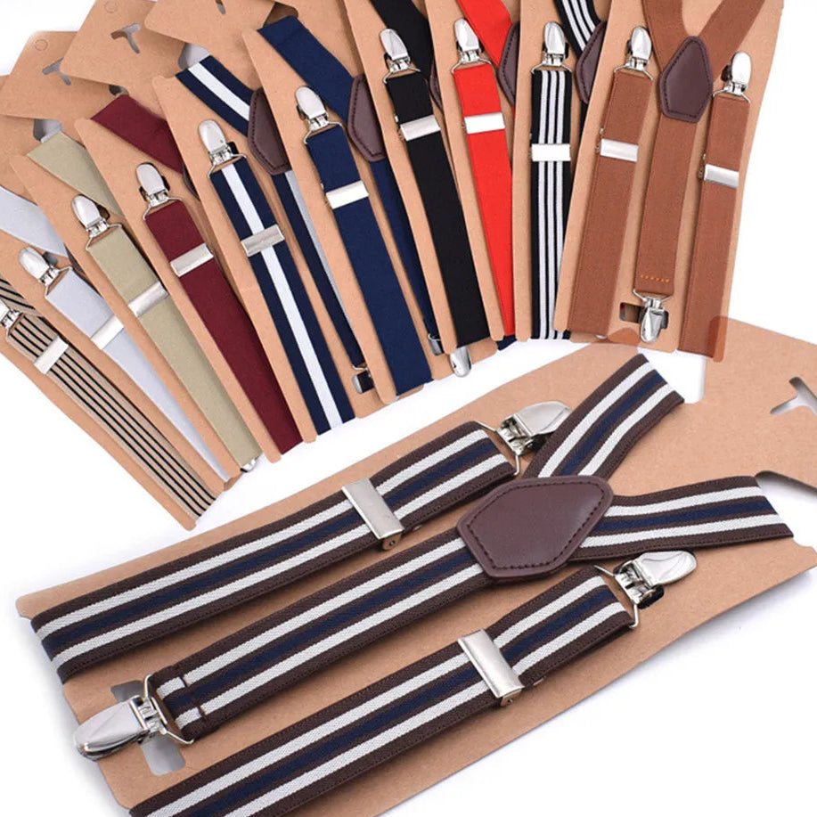 Flat lay of striped clip-on suspenders in several colors, including a brown pair in front