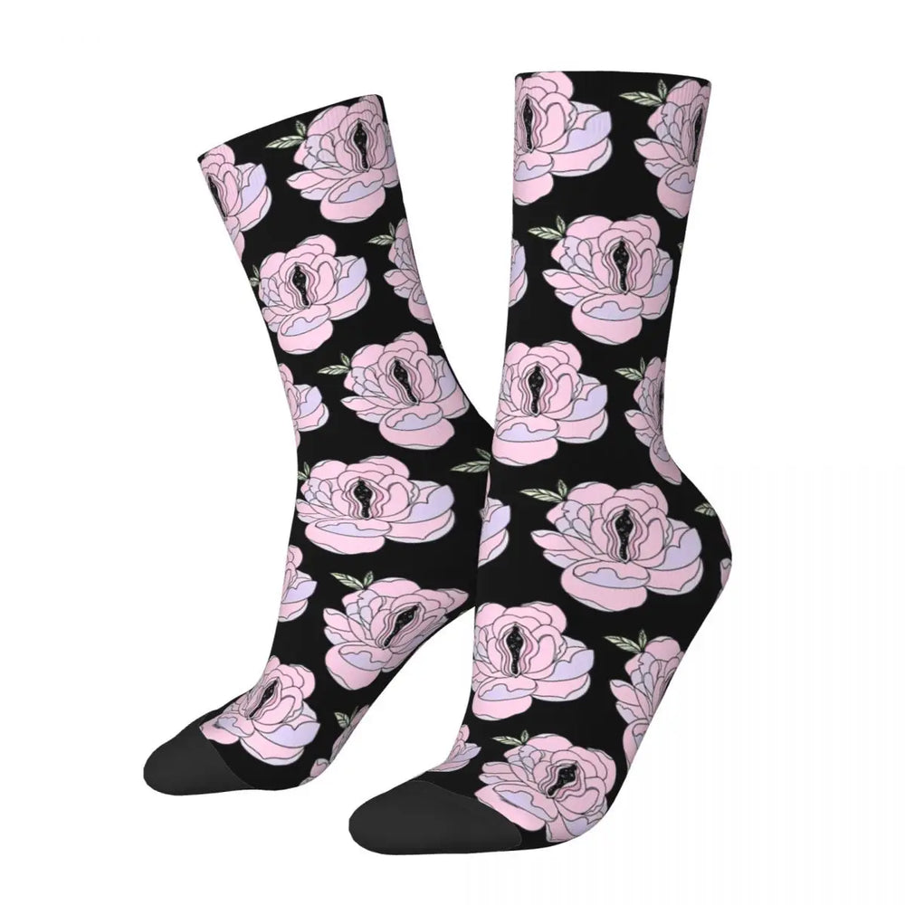 Pair of black crew socks with pink flowers featuring stylized vulva centers