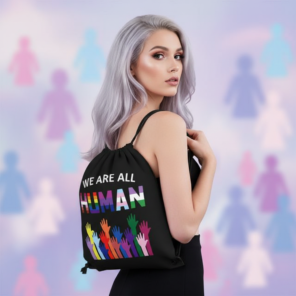 “We Are All Human” drawstring bag with bold slogan over vibrant raised hands, diverse silhouettes