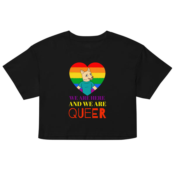 Front view of a black crop top with a rainbow heart, cartoon dog, and “WE ARE HERE AND WE ARE QUEER” text
