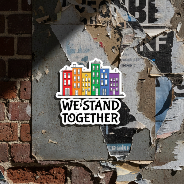 Bubble-free sticker set with six rainbow-colored buildings and the slogan “We Stand Together,”
