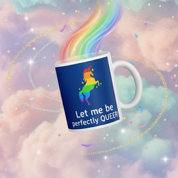 Close-up of a blue mug reading “Let me be perfectly QUEER!” with a rainbow unicorn