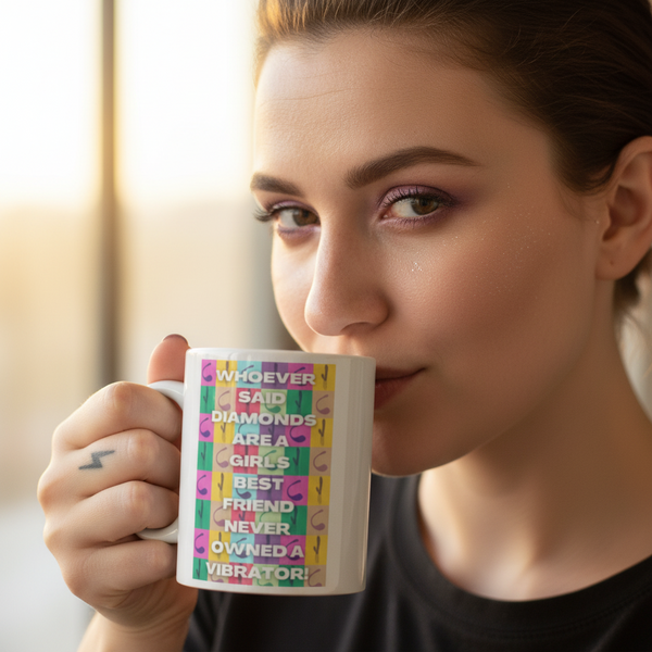 Young woman holding the Never Owned A Vibrator Mug with colorful checker pattern and bold statement, embodying queer pride and self-expression. Perfect for sharing vibrant moments of empowerment and joy.