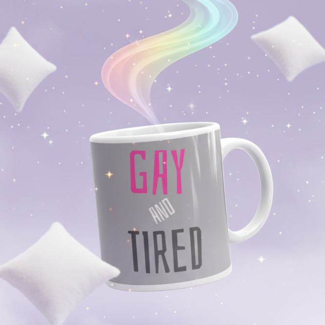 White mug reading “GAY AND TIRED,” with pastel rainbow steam and stars
