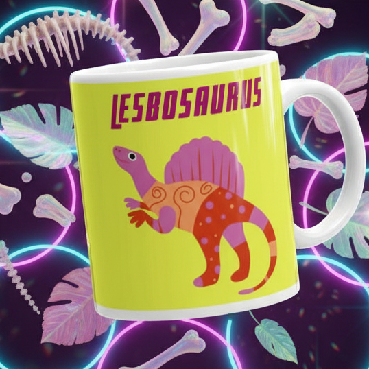 Lesbosaurus Mug: Features a vibrant dinosaur design with the word “LESBOSAURUS,” embodying queer pride and expression. Perfect for coffee or tea, it's sturdy, dishwasher, and microwave safe. Celebrate LGBTQIA+ joyfully and boldly.