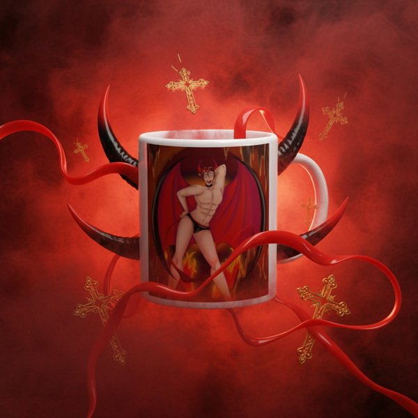 White mug with a horned, nearly nude winged figure in flames, surrounded by red devil tails